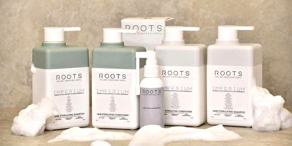 ROOTS Hair growth and treatments in rectangle bottles with pumps displayed  - Lunica Beauty distributor for Arizona, Nevada, and Utah - Salon professionals